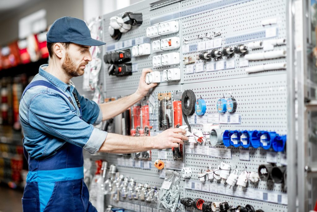 An engineer selecting tools/equipment in a store
