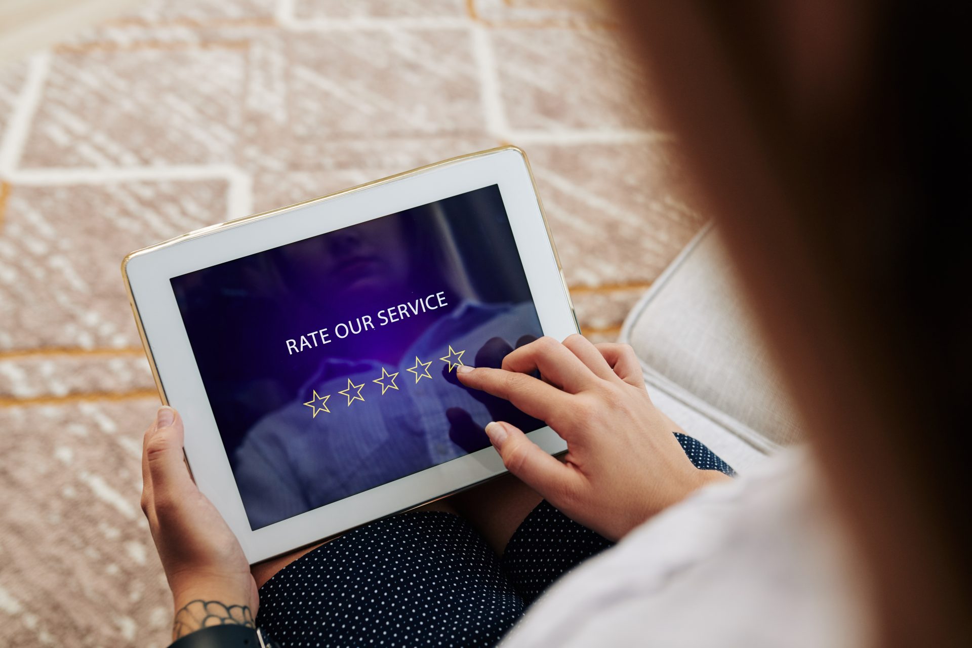 Customer rating their service on a tablet