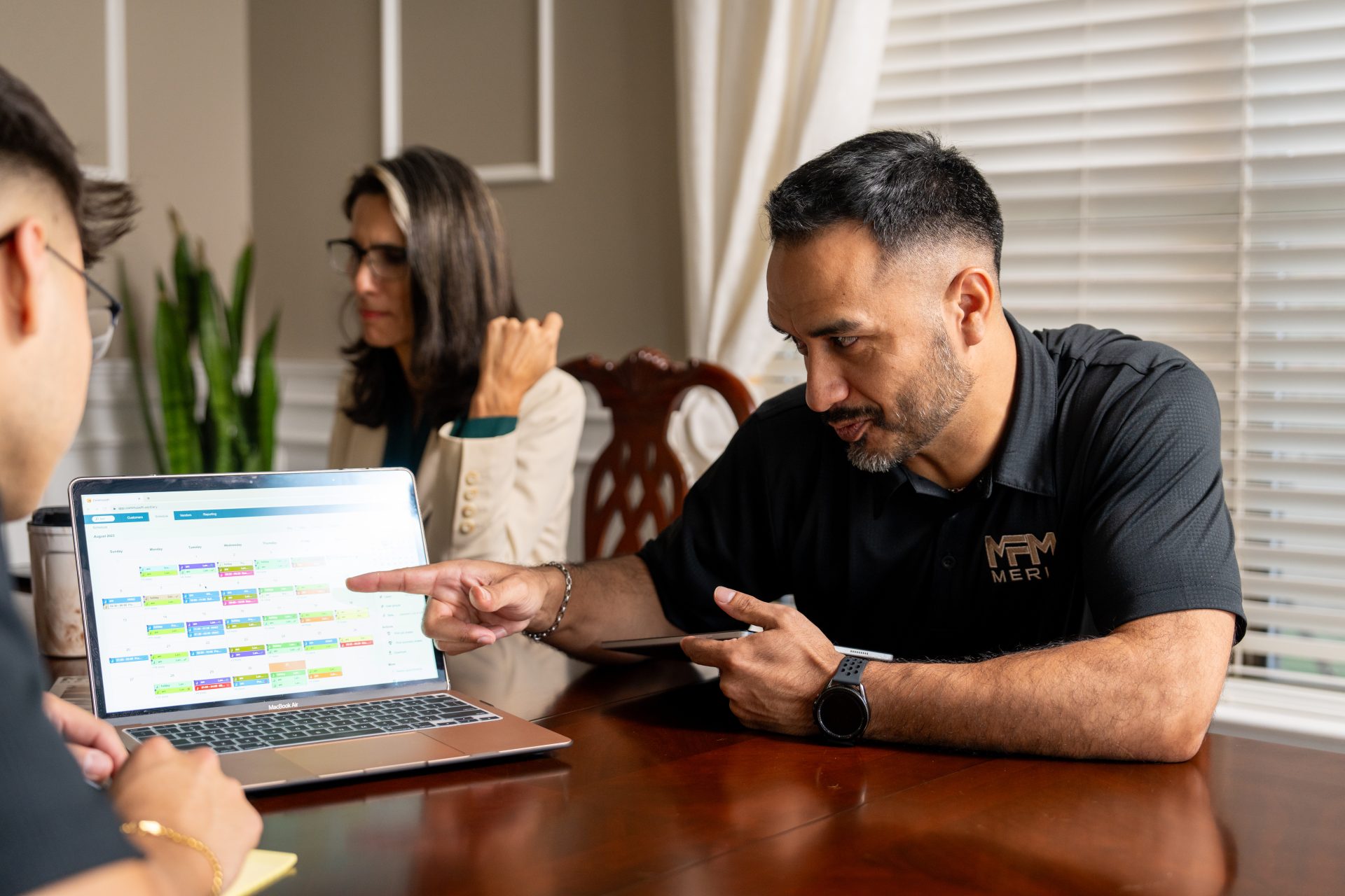 Merit Facility Management team looking at Commusoft's job scheduling feature on desktop