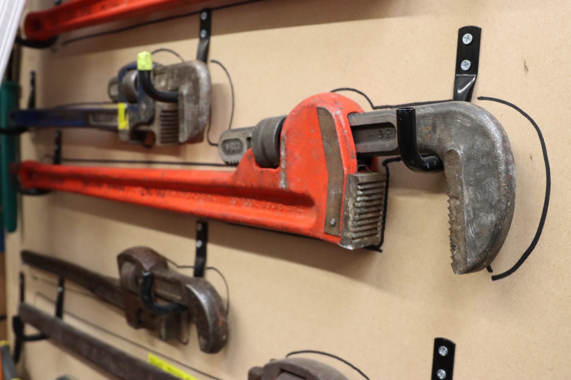 Plumbing tools fixed to a wall