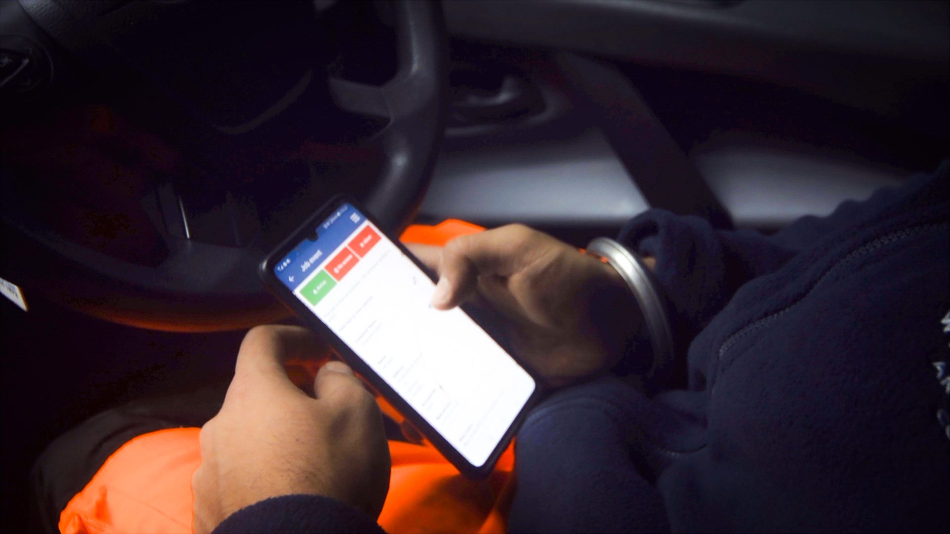 Engineer using Commusoft's app in their van