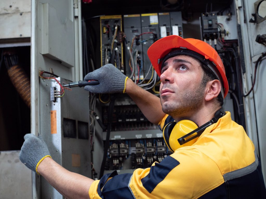 Engineer carrying out work with a screwdriver