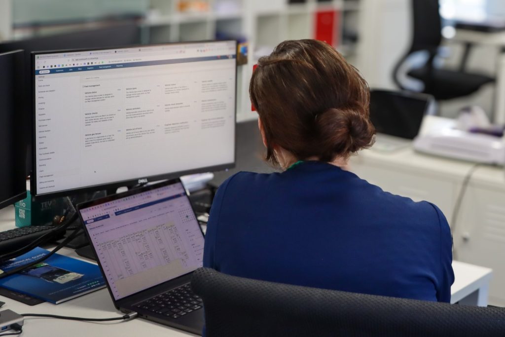 Employee working on Commusoft on desktop