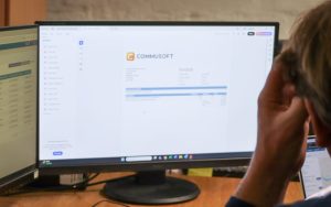 Employee using Commusoft to create an invoice