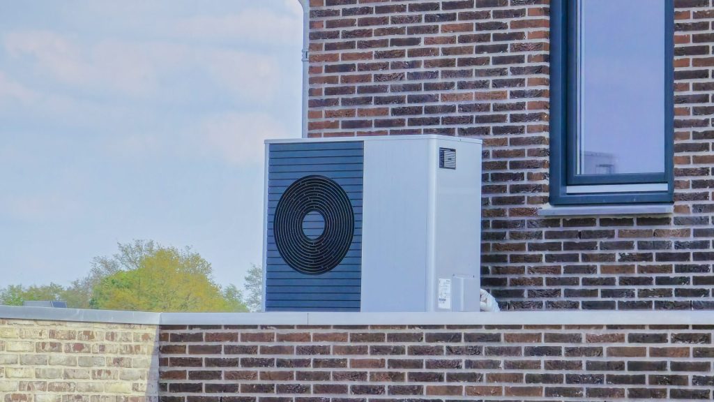 Air source heat pump situated on the exterior of a building