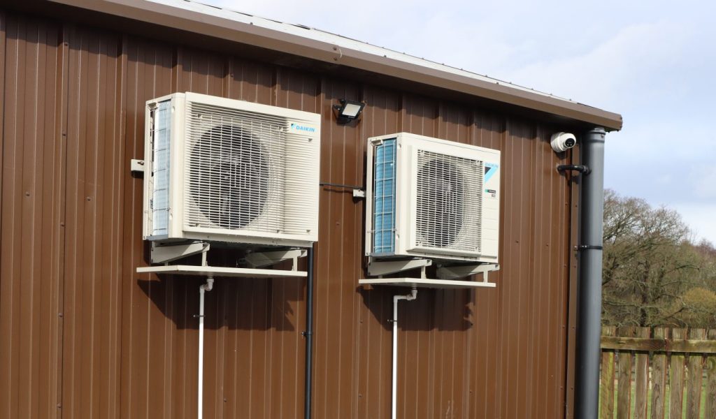 Two HVAC systems on the exterior of a building