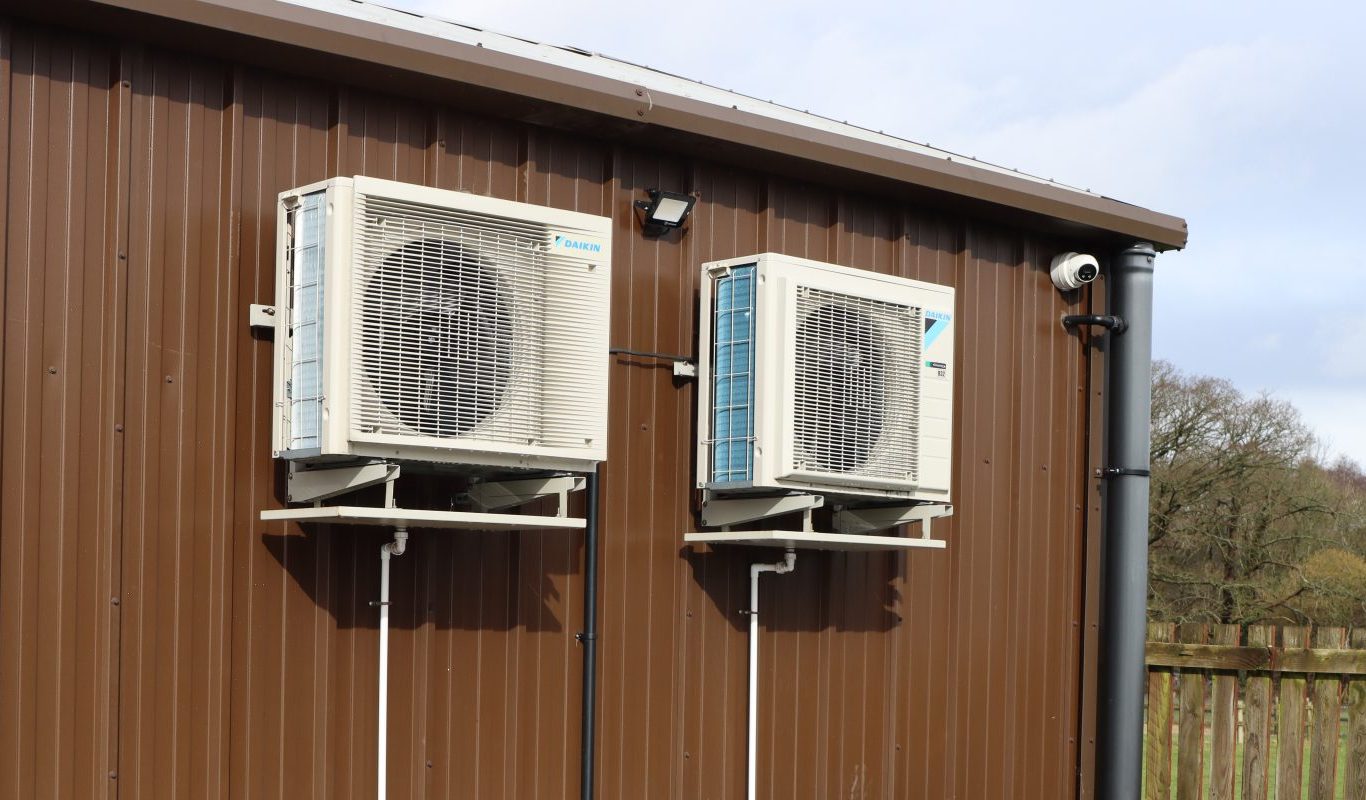 Two HVAC systems on the exterior of a building