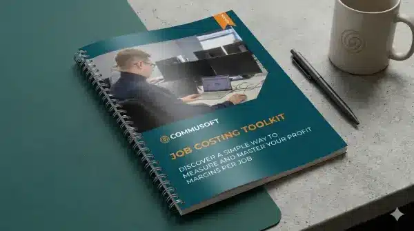 Commusoft Job Costing Toolkit eBook cover featuring a professional in an office setting, titled "Discover a simple way to measure and master your profit margins per job."